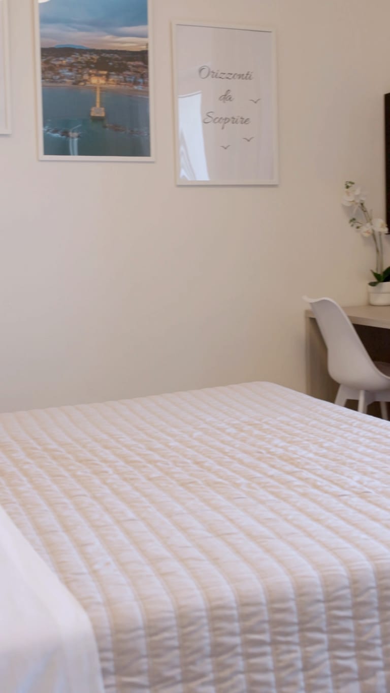 The Quiete room: the intimate double bed, in the neutral tones of the house